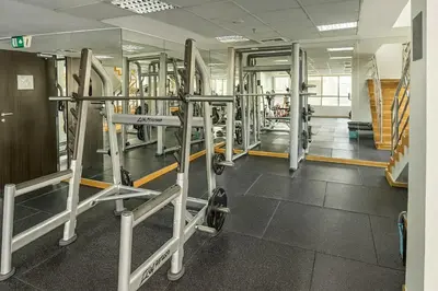 a gym with a row of tread machines at Luxury Marina View 2BR Apartment for 6 in Dubai