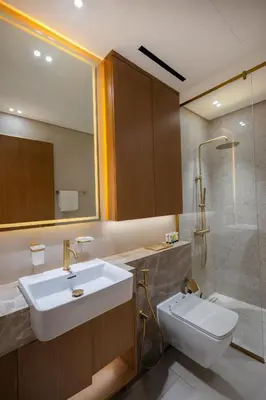a bathroom with a sink and a shower and a toilet at Luxury Studio with Private Jacuzzi at Trillionaire, Business Bay in Dubai