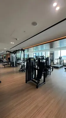 a gym with treadmills and ellipticals in a building at Luxury Studio with Private Jacuzzi at Trillionaire, Business Bay in Dubai