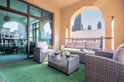 a living room with a couch and a table at Frank Porter - Al Tajer Residences in Dubai