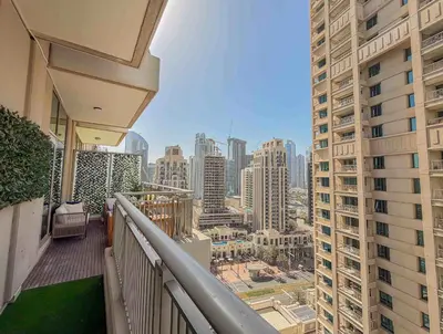 a balcony with a view of a city with tall buildings at Frank Porter - Blvd Central in Dubai