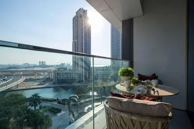 a balcony with a table and a view of a city at Frank Porter - Address Beach Resort Tower in Dubai