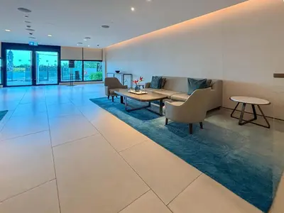 a living room with a couch and a table at Frank Porter - Address Beach Resort Tower in Dubai