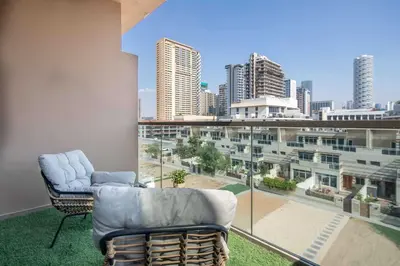 a living room with a view of a city skyline at Frank Porter - Eleganz 2 by Danube in Dubai