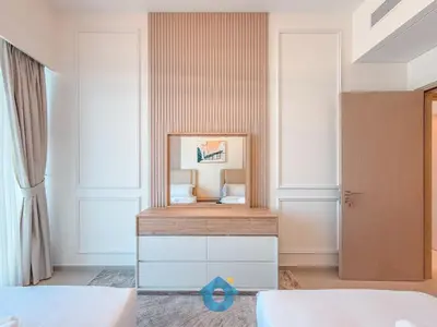 a bedroom with a mirror on a dresser at Enjoy Best Burj Khalifa View from Balcony Next to Dubai Mall Luxury 2BR Like Home in Dubai