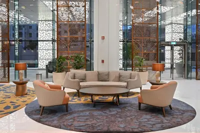 a lobby with a couch and two chairs and a table at Stunning 1BR Luxury Downtown Burj View Balcony in Dubai