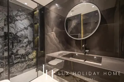 a bathroom with a sink and a mirror at LUX The Dubai Marina View Suite 3 in Dubai