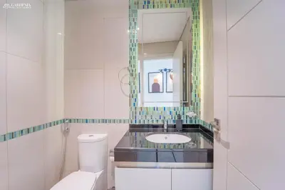 a bathroom with a sink and a toilet and a mirror at Damac Heights-Palm Jumeirah View-Elite Living in Dubai