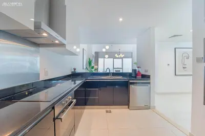 a large kitchen with a sink and a counter at Damac Heights-Palm Jumeirah View-Elite Living in Dubai
