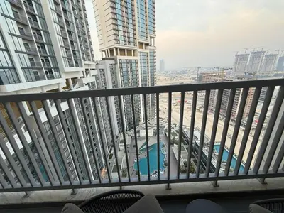 a balcony with a view of a city with tall buildings at Crest haven suite in Dubai