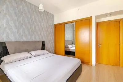 a bedroom with a large white bed in a room at DT Penthouse • 250sqm • Billiards • Terrace & Pool in Dubai