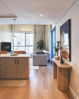 an open kitchen and living room with a couch at Bay Central Marina Suite with Exceptional Views in Dubai