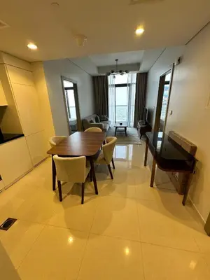 a dining room with a wooden table and chairs at Skyline 2BR - AYKON CITY Tower C-Business Bay 5101 in Dubai