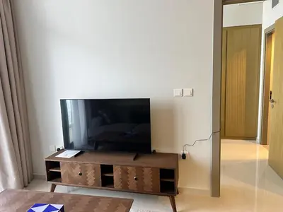 a living room with a flat screen tv on a table at Skyline 2BR - AYKON CITY Tower C-Business Bay 5101 in Dubai