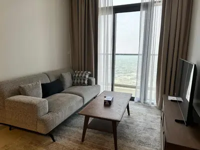 a living room with a couch and a tv and a table at Skyline 2BR - AYKON CITY Tower C-Business Bay 5101 in Dubai