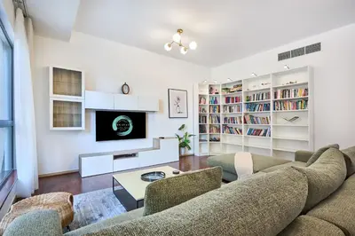 a living room with a couch and a fireplace at Family Stay JBR 3BR and maids room l Walk to Beach l Marina in Dubai