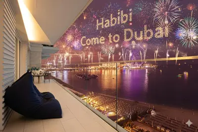 a view of a display in a building with fireworks at Luxurious 4BR La Vie JBR Private Beach Pool Panoramic Sea and Dubai Eye Views Drone Show Perfect for Family and Friends in Dubai