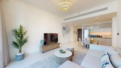 a living room with a couch and a table at Vacationer l Stunning 1 Bed l Sea View l Private Beach Access in Dubai
