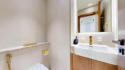 a bathroom with a sink and a mirror at Vacationer l Contemporary 1 Bed l City Views l near Circle Mall in Dubai