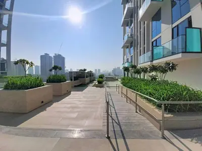 a walkway in the middle of a building at Vacationer l Contemporary 1 Bed l City Views l near Circle Mall in Dubai
