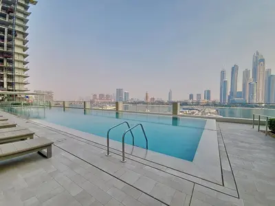 a swimming pool on the top of a building at Vacationer l Classic 2 Bedroom l Marina Views l Private Beach in Dubai