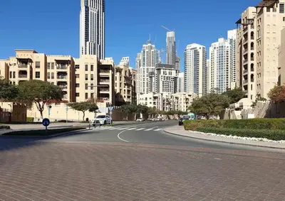 an empty street in a city with tall buildings at Vacationer l Upgraded Modern 2 Bed l Downtown l Near Dubai Mall in Dubai