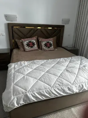 a bed with two pillows on top of it at Spacious 1 Bedroom Apartment-Opal Tower Dubai Marina in Dubai