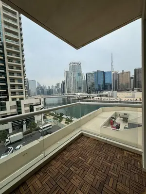 a balcony with a view of a city skyline at Burj Khalifa & Canal View Apartment in Dubai