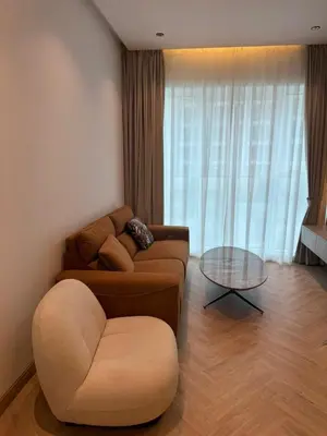 a living room with a couch and a table at Burj Khalifa & Canal View Apartment in Dubai