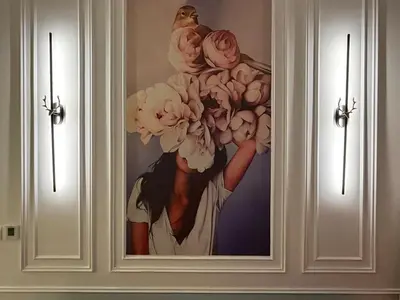 a painting of a woman holding a baby and flowers at Luxury 2BR Downtown Apartment - Canal & City Views in Dubai