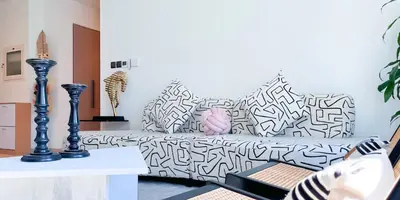 a living room with a black and white couch at Luxury in Dubai 2 bedroom apartment with balcony in Dubai