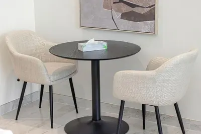 a black table with two chairs and a box on it at Modern Studio in Business Bay in Dubai
