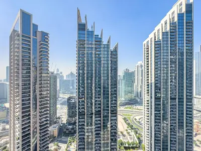a group of tall buildings in a city at Luxury 1BR Downtown, Pool, Gym, Opera District in Dubai