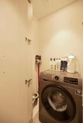 a laundry room with a washing machine in a room at the space in Dubai