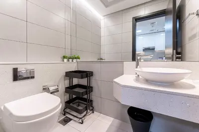 a bathroom with a white toilet and a sink at HAVN - 1 bedroom in The Wings, Arjan in Dubai