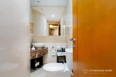 a bathroom with a toilet and a sink and a mirror at Sky-High 3BR in Trident Grand Residence in Dubai Marina & JBR with Epic Sea, Palm & Dubai Eye View in Dubai
