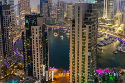 an aerial view of a city at night at LUX The Contemporary Marina View Suite 7 in Dubai