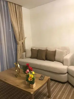 a living room with a couch and a coffee table at 2 Bedroom Luxury In Jaddaf in Dubai