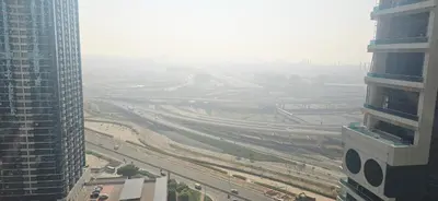 an aerial view of a highway in a city with tall buildings at Studio in JLT near Metro - Close to Marina, JBR in Dubai