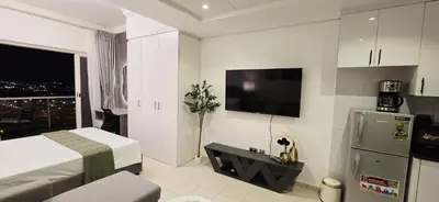 a hotel room with a bed and a television in it at Studio in JLT near Metro - Close to Marina, JBR in Dubai