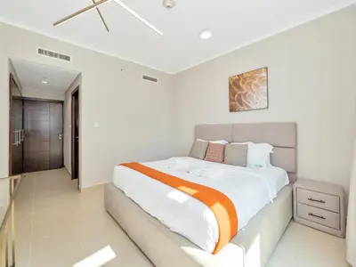 a bedroom with a large bed in a room at Skyline Upscale 2 Bedroom Apartment I Steps to Burj Khalifa Dubai Fountain Dubai Mall I Mesmerizing Views I Free Gym, Pool, Parking & Wi-Fi in Dubai