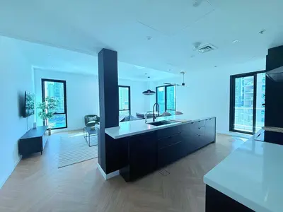 a large kitchen with a sink and a counter top at Luxury Upgraded 2BR in Dubai Marina in Dubai