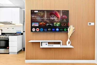 a kitchen with a wall with a tv on it at Chic 1BR Dubai Marina, 5 Min Walk JBR Beach, Metro in Dubai