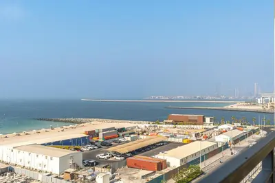 an aerial view of a city with a beach at Sunny & Stylish 1Bed 7-Min Walk to the Beach! in Dubai
