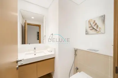 a bathroom with a sink and a mirror at Harbour-View 3BR with Assistant Room, Just a Stones Throw from Marine Transportation, Harbour Gate Tower 1, Creek Harbour by Deluxe Holiday Homes in Dubai
