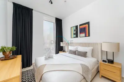 a bedroom with a white bed and a large window at Harbour-View 3BR with Assistant Room, Just a Stones Throw from Marine Transportation, Harbour Gate Tower 1, Creek Harbour by Deluxe Holiday Homes in Dubai