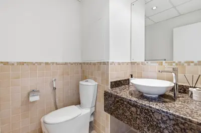 a bathroom with a toilet and a sink at Rimal 1, JBR - 2 Bedroom Apartment - Allsopp & Allsopp in Dubai