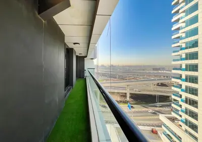 an office building hallway with a view of an airport at Brand New Two Bedrooms Apartment With Amazing Marina View in Dubai