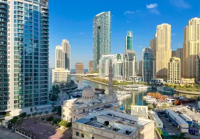 a view of a city with a river and buildings at Brand New Two Bedrooms Apartment With Amazing Marina View in Dubai