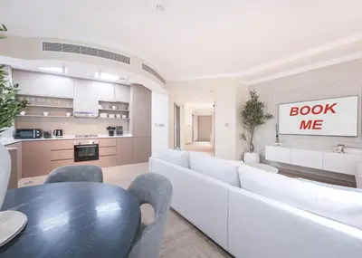a living room with a couch and a table at StayShort - 2 Bedroom in Dubai Marina with Huge Balcony in Dubai